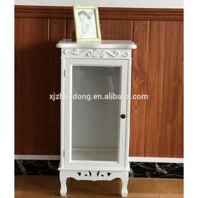 White wooden bedside table with one door