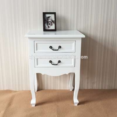 White wooden bedside table with two drawers